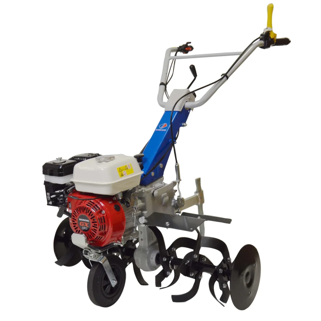 Motobineuse Staub ST PRO 115 HS : moteur Honda GX160, 2 AV + 1 AR, largeur 60 à 87 cm, 32 cm de profondeur. Robustesse pro avec transmission en bain d'huile.